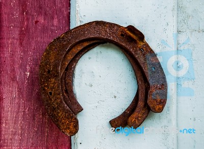 The Old Rusty Horseshoe On Wood Background Stock Photo