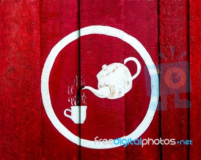 The Painting Of A Cup Of Coffee With Kettle On Wood Stock Photo