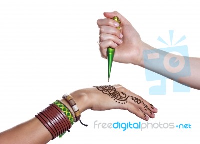 The Process Of Applying Mehendi On A Woman's Hand Stock Photo