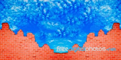 The Ruin Of Brickwall On Blue Sky Background Stock Photo