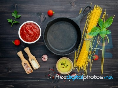 The Thin Spaghetti On Black Wooden Background. Yellow Italian Pa… Stock Photo