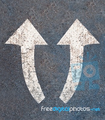 The White Arrow On The Road Background Stock Photo