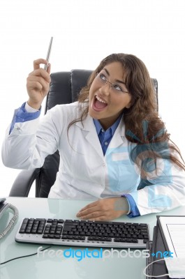 Thinking Young Doctor Looking Upward Stock Photo