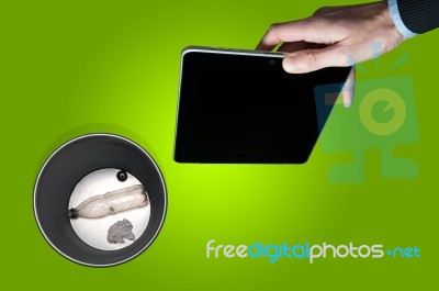 Throwing Away An Electronic Tablet Stock Photo