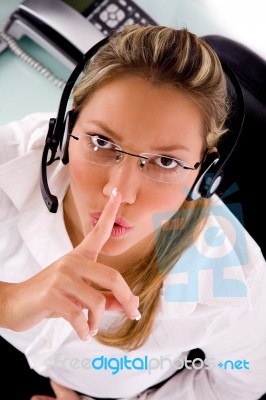 Top View Of Service Provider Instructing To Be Silent Stock Photo