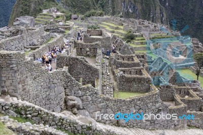 Tourists Exploring Machu Picchu Stock Photo