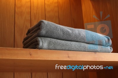 Towel On Wooden Shelf Stock Photo