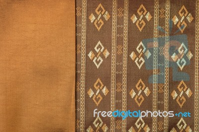 Traditional Brown Thai Fabric Pattern Stock Photo