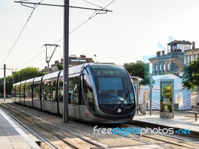 Tram Passing Through Bordeaux Stock Photo