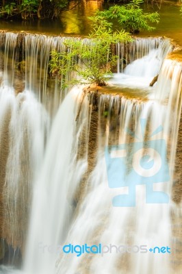 Tropical Waterfall In Kanchanaburi, Thailand Stock Photo