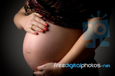 Tummy Of Pregnant Woman Stock Photo