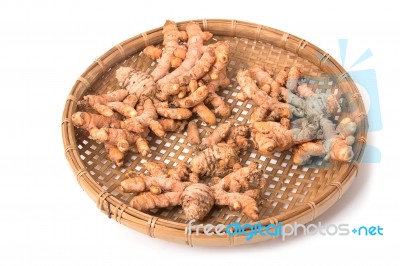Turmeric Root In The Basket On White Background Stock Photo