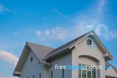 Twin Gable Roof House Under Sky Stock Photo