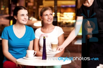 Two Beautiful Young Girls At Coffee Shop Stock Photo