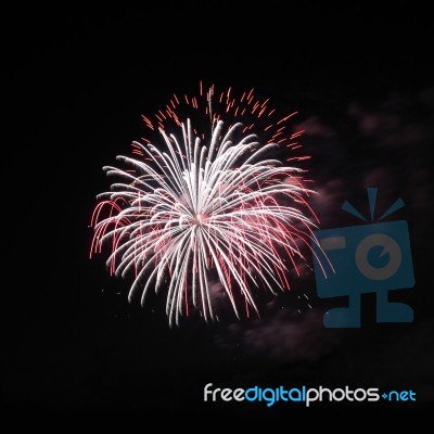 Two Overlap Firework Explode On Night Sky Stock Photo