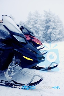 Two Snowmobiles In The Mountains Stock Photo