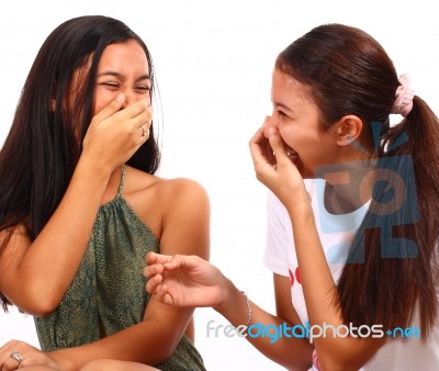 Two Teenager Girls Laughing And Giggling Stock Photo