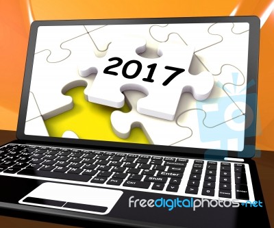 Two Thousand And Seventeen On Laptop Shows New Years Resolution Stock Image