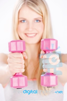 Two Weights In Woman's Hands Stock Photo