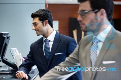 Two Young Executives Arriving At The Hotel Stock Photo