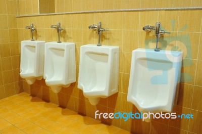 Urinals At Office Stock Photo