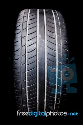 Used Tire On Black Stock Photo