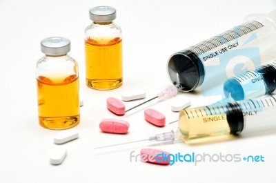 Vaccine / Hypodermic Syringe / Needle / Pills Stock Photo