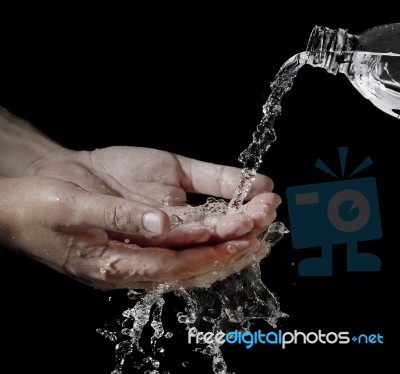 Water Flowing Into Hand Stock Photo