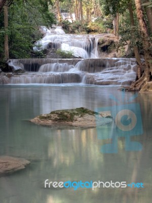 Waterfall That Flows Down To The Floor Stock Photo