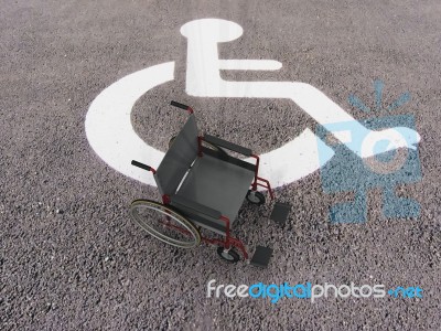 Wheelchair In Disabled Space Stock Image
