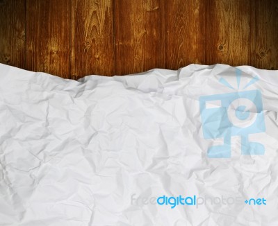 White Crumpled Paper On Wood  Stock Photo