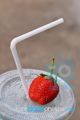 White Drinking Straw And Strawberry Stock Photo