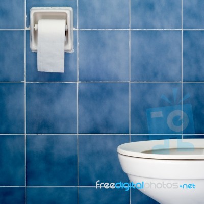 White Sanitary Ware And Tissues Stock Photo