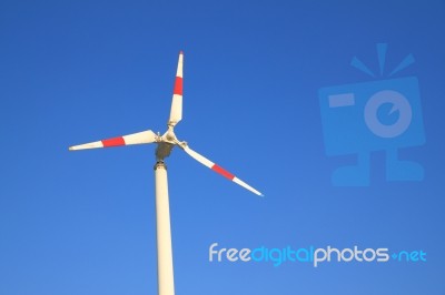 White Windmill With Red Bar Stock Photo