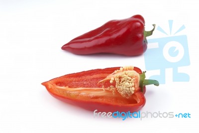 whole and halved Red Peppers Stock Photo