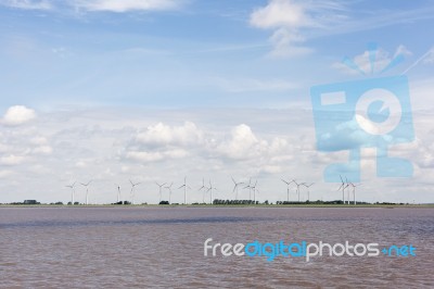 Wind Turbines Near River Stock Photo