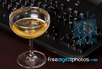 Wine Glass And Black Keyboard Stock Photo