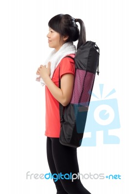 Woman Carrying Excercise Mat Stock Photo