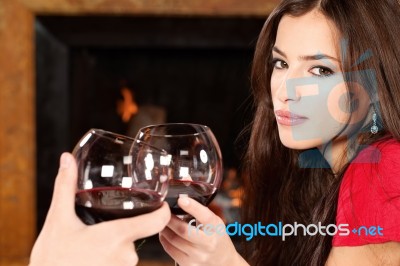Woman Cheers With Someone Stock Photo