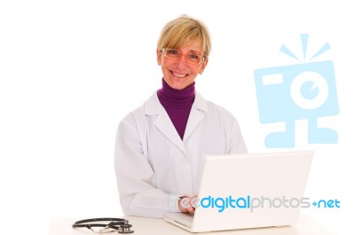 Woman Doctor With Laptop Stock Photo