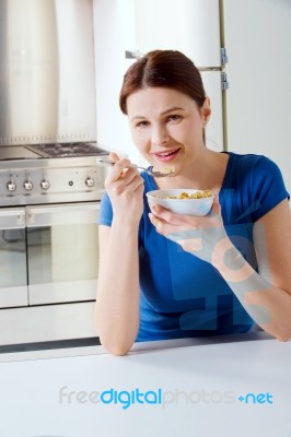 Woman Eating Cereal Stock Photo