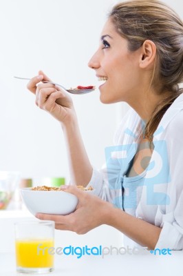 Woman Eating Cereals In The Morning Stock Photo