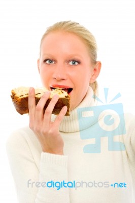 Woman Eating Panettone Stock Photo