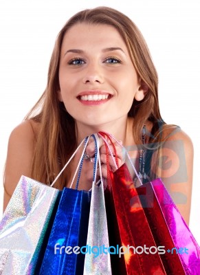 Woman Holding Lots Of Shopping Bags In Her Hand Stock Photo
