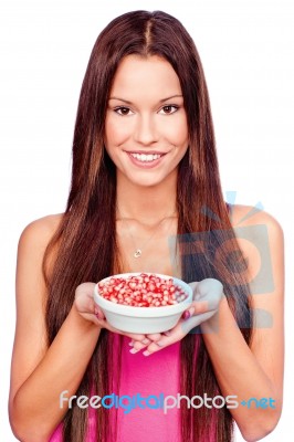 Woman Holding Pomegranate On Plate Stock Photo