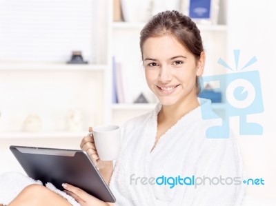 Woman In Bathrobe Relaxing At Home Stock Photo