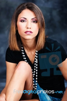 Woman In Black Shirt And Jeans Skirt Stock Photo