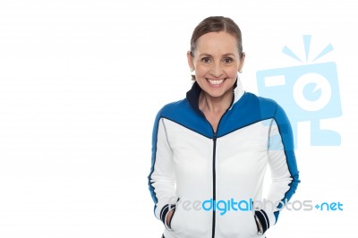 Woman In Sporty Jacket Smiling Warmly Stock Photo
