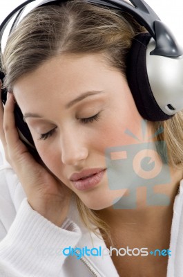 Woman Listening To Music With Closed Eyes Stock Photo