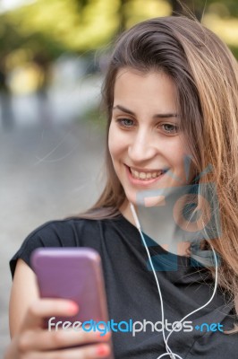Woman Listens Music Stock Photo